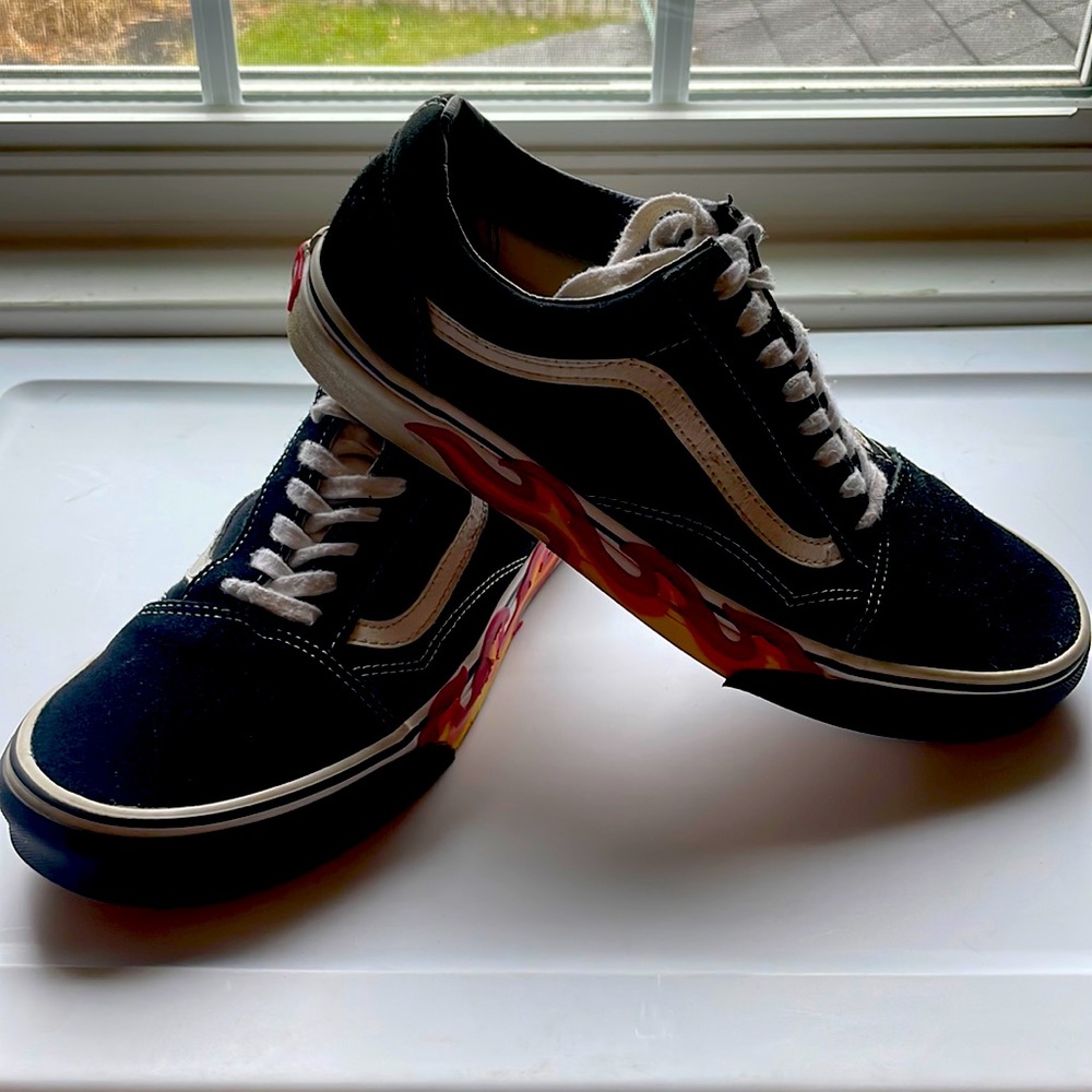 Black and white Vans with flame on side